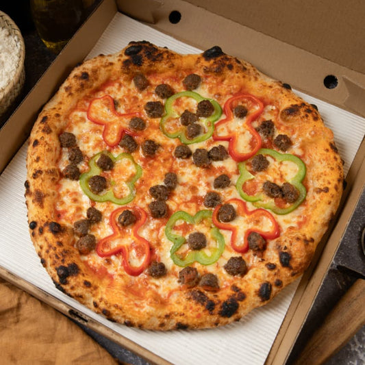 Pizza with bell peppers and olives in a 'maillard's' branded box